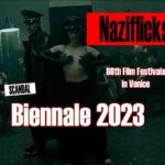 Das gezeigte Nazifilmchen aus den 70ern. Eine Frau, wohl ein Naziopfer, steht in SS-Uniform da, aber "oben ohne", d.h. mit nackter Brust. Sie steht zentral im Bild in hypnotisierender Pose. Die Farben sind abendlich halbdunkel. Es ist eine Art Spelunke und es sind ettliche andere Personen in solchen Posen in der Szene zu sehen.